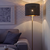 NYMÖ / SKAFTET Podna lampa, crna mesing/mesing