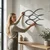 WallXpert metalni zidni ukras 5059, tri stilizovane ribe, 75 x 45 cm, crni