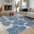 Modra pralna preproga 60x100 cm Blue Meadow – Mila Home