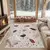 Kremno bela pralna preproga 60x100 cm Cracked Terrazzo – Mila Home