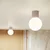 Sivorjava stenska svetilka Orbital – Nice Lamps