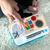 Baby Einstein Igrača Glasbena kuhinja Magic Touch Kitchen Pretend to Cook HAPE 9m+