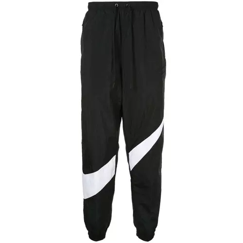 Nike swoosh track pants sales